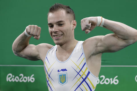 Ukraine's Oleg Verniaiev celebrates after his performance on the parallel bars during the artistic gymnastics men's apparatus final at the 2016 Summer Olympics in Rio de Janeiro, Brazil, Tuesday, Aug. 16, 2016. (AP Photo/Rebecca Blackwell)