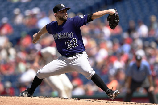 Colorado Rockies starting pitcher Tyler Chatwood throws during the first inning of a baseball game against the Philadelphia Phillies on Sunday, Aug. 14, 2016, in Philadelphia. (AP Photo/Michael Perez)