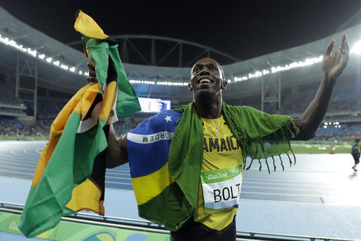 Usain Bolt from Jamaica celebrates after winning the gold medal in the men's 200-meter final, during the athletics competitions of the 2016 Summer Olympics at the Olympic stadium in Rio de Janeiro, Brazil, Thursday, Aug. 18, 2016. (AP Photo/Matt Dunham)