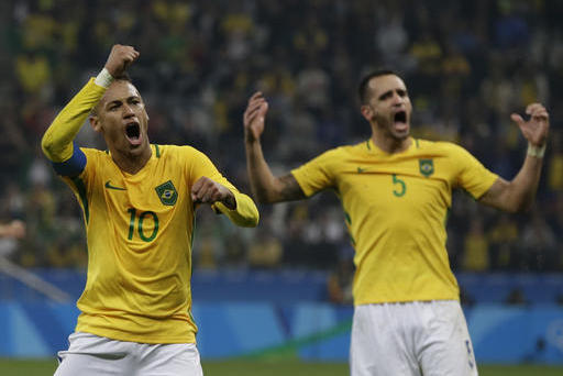 Brazil's Neymar, left, and Renato Augusto celebrate at the end of a quarter-final match of the men's Olympic football tournament against Colombia in Sao Paulo, Brazil, Saturday Aug. 13, 2016. Brazil won 2-0 and qualified for the semi-finals.(AP Photo/Leo Correa)