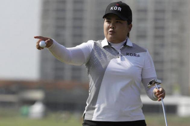 Inbee Park of South Korea gestures after putting the 10th hole during the third round of the women's golf event at the 2016 Summer Olympics in Rio de Janeiro, Brazil, Friday, Aug. 19, 2016. (AP Photo/Alastair Grant)