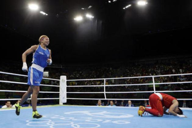 France's Estelle Mossely, left, cerebrates after winning a women's lightweight 60-kg final boxing match against China's Yin Junhua at the 2016 Summer Olympics in Rio de Janeiro, Brazil, Friday, Aug. 19, 2016. (AP Photo/Frank Franklin II)