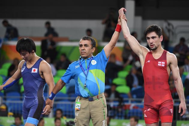 Georgia's Vladimer Khinchegashvili (R) celebrates after winning against Japan's Rei Higuchi in their men's 57kg freestyle final match on August 19, 2016, during the wrestling event of the Rio 2016 Olympic Games at the Carioca Arena 2 in Rio de Janeiro. / AFP / Toshifumi KITAMURA (Photo credit should read TOSHIFUMI KITAMURA/AFP/Getty Images)