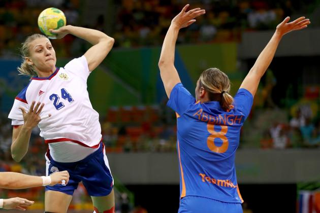 RIO DE JANEIRO, BRAZIL - AUGUST 14: Irina Bliznova #24 of Russia takes a shot as Lois Abbingh #8 of Netherlands defends on Day 9 of the Rio 2016 Olympic Games at the Future Arena on August 14, 2016 in Rio de Janeiro, Brazil. (Photo by Elsa/Getty Images)