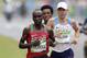 Kenya's Eliud Kipchoge and US Galen Rupp run during the Men's Marathon athletics event at the Rio 2016 Olympic Games in Rio de Janeiro on August 21, 2016. / AFP / Adrian DENNIS (Photo credit should read ADRIAN DENNIS/AFP/Getty Images)