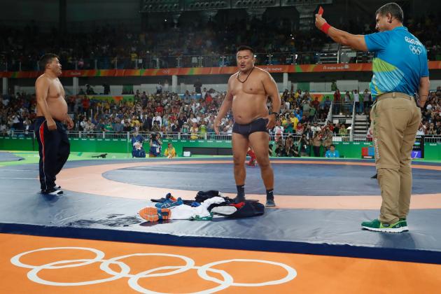 Mongolia's Mandakhnaran Ganzorig's coaches react after the judges announced that Uzbekistan's Ikhtiyor Navruzov won folling a video replay in their men's 65kg freestyle bronze medal match on August 21, 2016, during the wrestling event of the Rio 2016 Olympic Games at the Carioca Arena 2 in Rio de Janeiro. / AFP / Jack GUEZ (Photo credit should read JACK GUEZ/AFP/Getty Images)