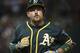 Oakland Athletics' Billy Butler heads back to the dugout after flying out against the Cleveland Indians during the ninth inning of a baseball game in Cleveland, Saturday, July 30, 2016. (AP Photo/Phil Long)