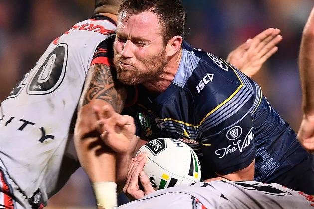 TOWNSVILLE, AUSTRALIA - AUGUST 20:  Gavin Cooper of the Cowboys is tackled by Albert Vete of the Warriors  during the round 24 NRL match between the North Queensland Cowboys and the New Zealand Warriors at 1300SMILES Stadium on August 20, 2016 in Townsville, Australia.  (Photo by Ian Hitchcock/Getty Images)
