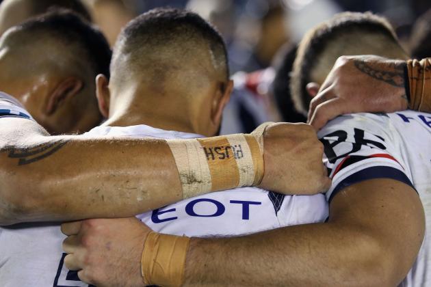 SYDNEY, AUSTRALIA - AUGUST 27:  Players pray after the round 25 NRL match between the Cronulla Sharks and the Sydney Roosters at Shark Park on August 27, 2016 in Sydney, Australia.  (Photo by Jason McCawley/Getty Images)