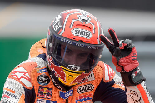 Moto GP rider Marc Marquez of Spain celebrates after finishing third in the Czech Republic Motorcycle Grand Prix in Brno, Czech Republic, Sunday, Aug. 21, 2016. (AP Photo/Jens Meyer)