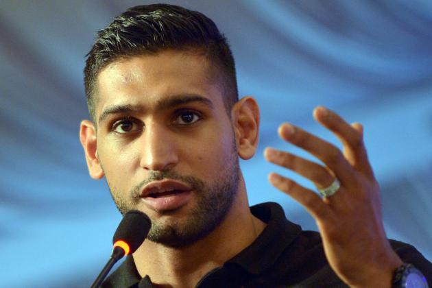British boxer Amir Khan addresses a press conference in the Pakistani city of Karachi on June 1, 2016. 


British boxer Amir Khan hailed the decision to allow professional boxers at the upcoming Olympic Games in Rio de Janeiro, saying he would love to represent the country of his parents' birth, Pakistan. / AFP / RIZWAN TABASSUM        (Photo credit should read RIZWAN TABASSUM/AFP/Getty Images)