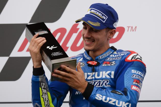 Winner Team Suzuki ECSTAR Maverick Vinales celebrates on the podium after the MotoGP race at the motorcycling British Grand Prix at Silverstone circuit in Northamptonshire, southern England, on September 4, 2016.   / AFP / OLI SCARFF        (Photo credit should read OLI SCARFF/AFP/Getty Images)