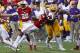 GREEN BAY, WI - SEPTEMBER 03: Josh Boutte #76 of the LSU Tigers delivers a late hit against D'Cota Dixon #14 of the Wisconsin Badgers after Dixon intercepted a pass during the fourth quarter at Lambeau Field on September 3, 2016 in Green Bay, Wisconsin. Boutte was disqualified from the game. (Photo by Jonathan Daniel/Getty Images)