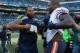 SEATTLE, WA - SEPTEMBER 27: Defensive end Michael Bennett #72 (L) of the Seattle Seahawks is greeted by his younger brother Martellus Bennett #83 of the Chicago Bears after the game at CenturyLink Field on September 27, 2015 in Seattle, Washington. (Photo by Otto Greule Jr/Getty Images)