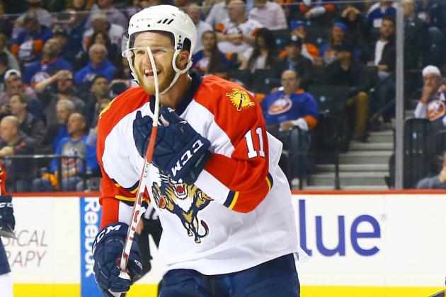 Apr 20, 2016; Brooklyn, NY, USA; Florida Panthers left wing Jonathan Huberdeau (11) reacts after his teammate defenseman Alex Petrovic (not pictured) scored the game winning goal against the  New York Islanders during the third period of game four of the first round of the 2016 Stanley Cup Playoffs against the Florida Panthers at Barclays Center. The Panthers won 2-1. Mandatory Credit: Andy Marlin-USA TODAY Sports