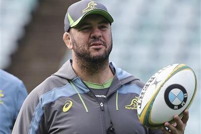 Australia rugby coach Michael Cheika watches the team during a captains run in Sydney, Australia, Friday, June 24, 2016. Australia's attempts to barge through the middle of England's defensive line didn't work during the opening two matches, so the Wallabies will try to stretch the visitors out wide in a bid to win on Saturday and avoid a three-test whitewash. (AP Photo/Rob Griffith)