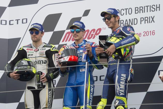 NORTHAMPTON, ENGLAND - SEPTEMBER 04:  (L-R) Cal Crutchlow  of Great Britain and LCR Honda, Maverick Vinales of Spain and Team Suzuki ECSTAR  and Valentino Rossi of Italy and Movistar Yamaha MotoGP celebrate on the podium at the end of the MotoGP race during the MotoGp Of Great Britain - Race at Silverstone Circuit on September 4, 2016 in Northampton, England.  (Photo by Mirco Lazzari gp/Getty Images)