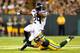 GREEN BAY, WI - SEPTEMBER 20: Marshawn Lynch #24 of the Seattle Seahawks runs the ball against Nick Perry #53 of the Green Bay Packers during the first quarter in their game at Lambeau Field on September 20, 2015 in Green Bay, Wisconsin. (Photo by Maddie Meyer/Getty Images)