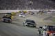 Denny Hamlin rounds Turn 1 followed by Martin Truex Jr. during the NASCAR Sprint Cup auto race at Richmond International Raceway in Richmond, Va., Saturday, Sept. 10, 2016. (AP Photo/Chet Strange)