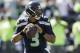 Seattle Seahawks quarterback Russell Wilson passes against the Miami Dolphins in the first half of an NFL football game, Sunday, Sept. 11, 2016, in Seattle. (AP Photo/Stephen Brashear)