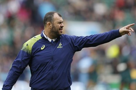 Australia’s coach Michael Cheika gestures on the pitch before the Rugby World Cup quarterfinal match between Australia and Scotland at Twickenham Stadium, London, Sunday, Oct. 18, 2015. (AP Photo/Frank Augstein)
