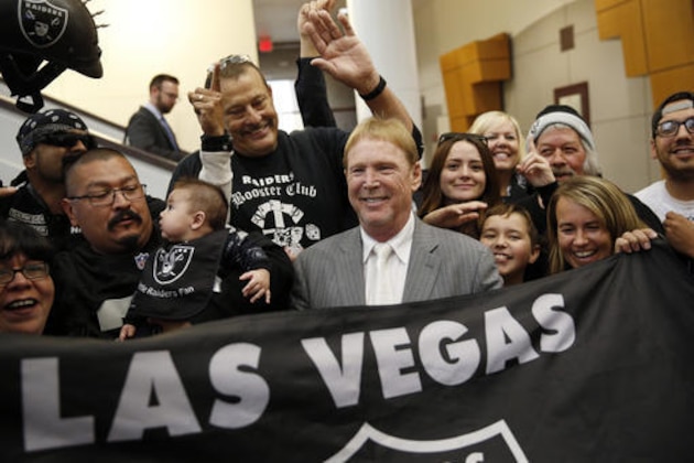 FILE - In this April 28, 2016 file photo, Oakland Raiders owner Mark Davis, center, meets with Raiders fans after speaking at a meeting of the Southern Nevada Tourism Infrastructure Committee in Las Vegas. Proponents of an NFL football stadium in Las Vegas aren't budging on their request for $750 million in hotel tax dollars and don't want to return any profits to the public. An oversight committee could finalize a recommendation for the Legislature next week. (AP Photo/John Locher, File) FILE - In this April 28, 2016 file photo, Oakland Raiders owner Mark Davis, center, meets with Raiders fans after speaking at a meeting of the Southern Nevada Tourism Infrastructure Committee in Las Vegas. Proponents of an NFL football stadium in Las Vegas aren't budging on their request for $750 million in hotel tax dollars and don't want to return any profits to the public. An oversight committee could finalize a recommendation for the Legislature next week. (AP Photo/John Locher, File)