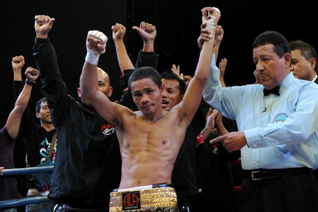 World Boxing Organization light-flyweight champion Donnie Nietes (C) of the Philippines celebrates after defeating Mexican challenger Felipe Salguero on June 2, 2012 during a WBO light-flyweight title bout in Manila, retaining his title. AFP PHOTO / Jay DIRECTO (Photo credit should read JAY DIRECTO/AFP/GettyImages)