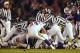 07 Jan 2002: Officials try to get to the bottom of the pile to rule on a fumble recovery as the Baltimore Ravens host the Minnesota Vikings in the second qurter of week 17 NFL action at PSINet Stadium in Baltimore, Maryland. DIGITAL IMAGE. Mandatory Credit: Doug Pensinger/Getty Images