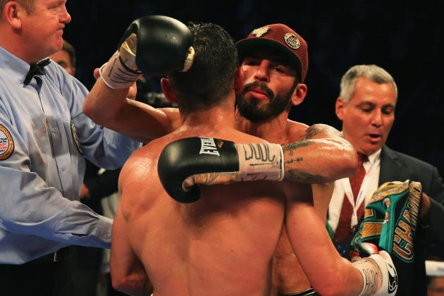 MANCHESTER, ENGLAND - SEPTEMBER 24:  Jorge Linares (cap) embraces Anthony Crolla as he is awarded victory after their contest for WBA, WBC Diamond and Ring Magazine Lightweight World Titlesat Manchester Arena on September 24, 2016 in Manchester, England.  (Photo by Ben Hoskins/Getty Images)