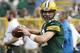 Green Bay Packers quarterback Aaron Rodgers warms up before an NFL football game against the Detroit Lions Sunday, Sept. 25, 2016, in Green Bay, Wis. (AP Photo/Mike Roemer)