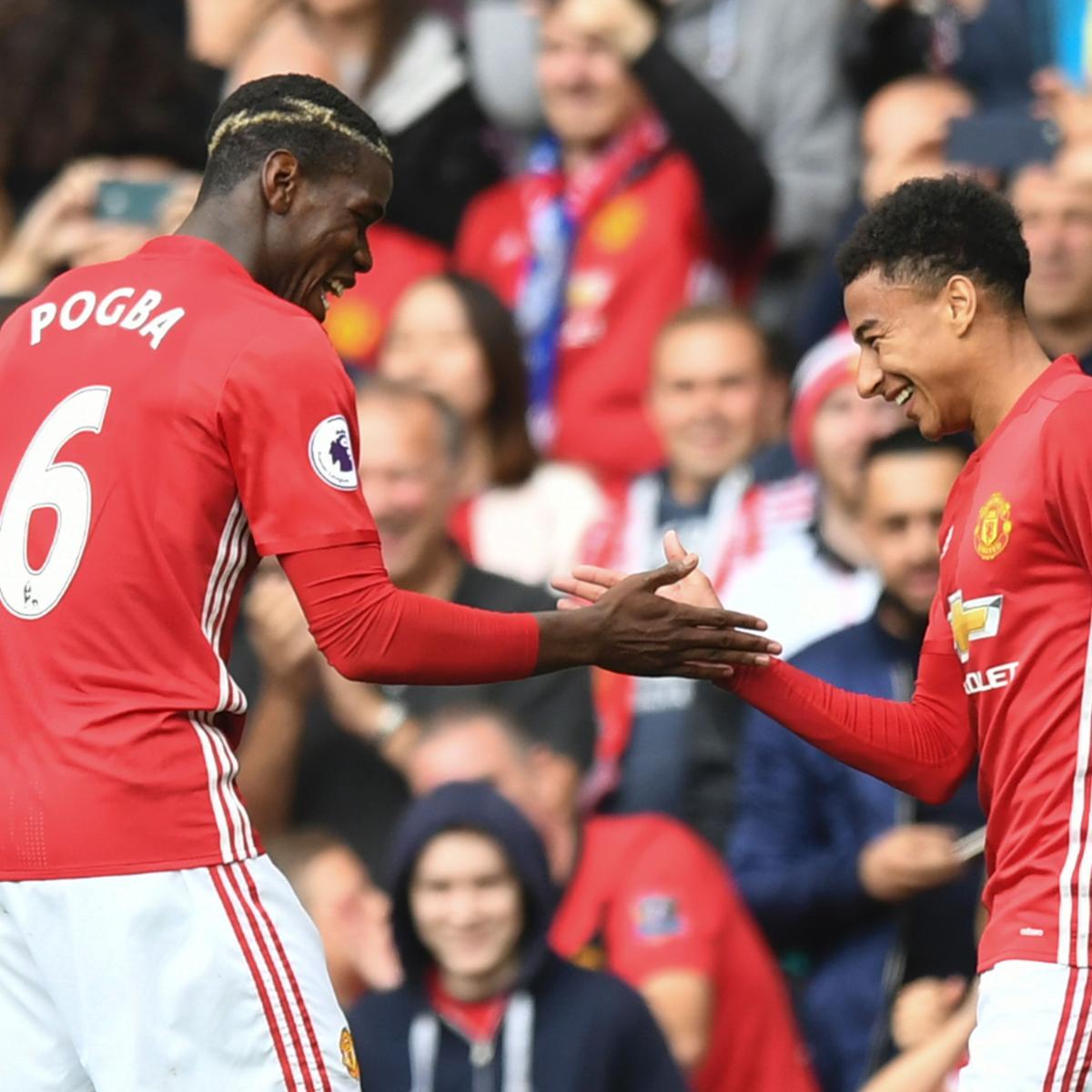 Marcus Rashford and Jesse Lingard work on Pogba-inspired handshake en route  to London (and check out £89m star's 24-carat gold-plated rucksack!)