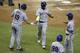 New York Mets' Jose Reyes (7) is met by Jay Bruce (19) and Ty Kelly (56) after Reyes and Kelly scored in the eighth inning on a single by Curtis Granderson during a baseball game against the Miami Marlins, Tuesday, Sept. 27, 2016, in Miami. The Mets defeated the Marlins 12-1. (AP Photo/Lynne Sladky)