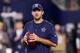ARLINGTON, TX - SEPTEMBER 25: Injured Tony Romo #9 of the Dallas Cowboys throws prior to a game against the Chicago Bears at AT&T Stadium on September 25, 2016 in Arlington, Texas. (Photo by Tom Pennington/Getty Images)