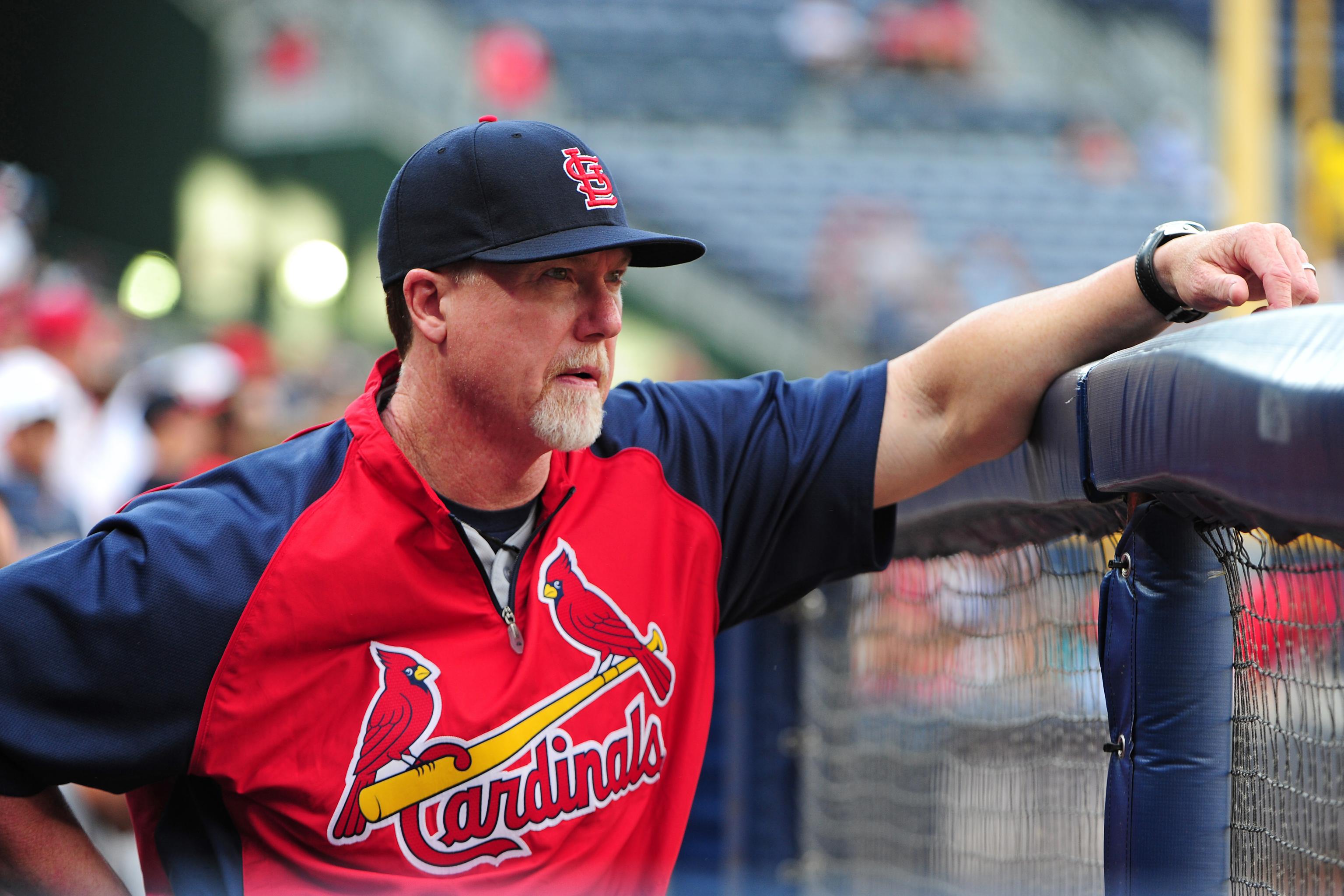 St. Louis Cardinals hitting coach Mark McGwire watches his team