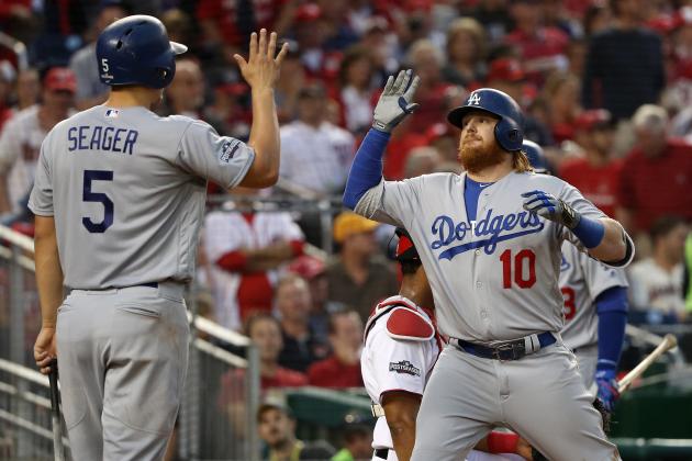 WASHINGTON, DC - OCTOBER 7: Justin Turner #10 of the Los Angeles Dodgers celebrates with teammate Corey Seager #5 after hitting a two run home run in the third inning against the Washington Nationals in game one of the National League Division Series at Nationals Park on October 7, 2016 in Washington, DC. (Photo by Patrick Smith/Getty Images)