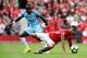 MANCHESTER, ENGLAND - SEPTEMBER 10: Marcus Rashford of Manchester United in action with Bacary Sagna of Manchester City during the Premier League match between Manchester United and Manchester City at Old Trafford on September 10, 2016 in Manchester, England. (Photo by Clive Brunskill/Getty Images)