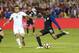 Oct 11, 2016; Washington, D.C., USA; United States forward Julian Green (19) shoots the ball as New Zealand midfielder Clayton Lewis (15) defends in the second half at RFK Stadium. The game ended in a 1-1 tie. Mandatory Credit: Geoff Burke-USA TODAY Sports