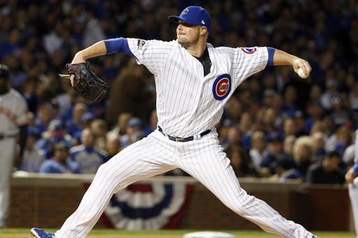 Chicago Cubs starting pitcher Jon Lester (34) throws in the first inning of Game 1 of baseball's National League Division Series against the San Francisco Giants, Friday, Oct. 7, 2016, in Chicago. (AP Photo/Nam Y. Huh)