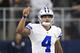 ARLINGTON, TX - OCTOBER 09: Dak Prescott #4 of the Dallas Cowboys warms up on the sidelines before the start of a game against the Cincinnati Bengals at AT&T Stadium on October 9, 2016 in Arlington, Texas. The Cowboys defeated the Bengals 28-14. (Photo by Wesley Hitt/Getty Images)
