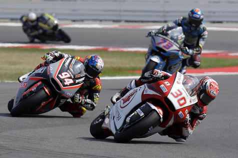 Japan's rider Takaaki Nakagami, bottom right, steers his Kalex on his way to take third place during the San Marino Moto 2 grand prix at the Misano circuit, in Misano Adriatico, Italy, Sunday, Sept. 11, 2016. (AP Photo/Antonio Calanni)