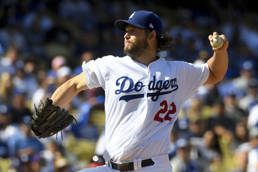 FILE - In this Oct. 11, 2016, file photo, Los Angeles Dodgers starting pitcher Clayton Kershaw throws against the Washington Nationals during the first inning in Game 4 of baseball's National League Division Series in Los Angeles. The Chicago Cubs return home just one win shy of their first World Series appearance in 71 years, and they will have two chances to lock it up, leading the Los Angeles Dodgers 3-2 in the NLCS. The Cubs will send major league ERA champion Kyle Hendricks to the mound on Saturday against Dodgers ace Clayton Kershaw.  (AP Photo/Mark J. Terrill, File)
