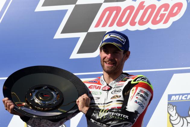 LCR Honda's British rider Cal Crutchlow celebrates his victory on the podium after the MotoGP race at the Australian Grand Prix at Phillip Island on October 23, 2016. / AFP / SAEED KHAN / IMAGE RESTRICTED TO EDITORIAL USE - STRICTLY NO COMMERCIAL USE        (Photo credit should read SAEED KHAN/AFP/Getty Images)