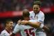 Sevilla's French midfielder Steven N'Zonzi (back) celebrates a goal with Sevilla's French midfielder Samir Nasri (R) during the Spanish league football match between Sevilla FC and Club Atletico de Madrid at the Ramon Sanchez Pizjuan stadium in Sevilla on October 23, 2016. / AFP / CRISTINA QUICLER (Photo credit should read CRISTINA QUICLER/AFP/Getty Images)