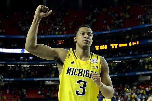 ATLANTA, GA - APRIL 06:  Trey Burke #3 of the Michigan Wolverines celebrates the Wolverines 61-56 victory against the Syracuse Orange during the 2013 NCAA Men's Final Four Semifinal at the Georgia Dome on April 6, 2013 in Atlanta, Georgia.  (Photo by Streeter Lecka/Getty Images)