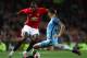 Paul Pogba in derby action against Nicolas Otamendi.