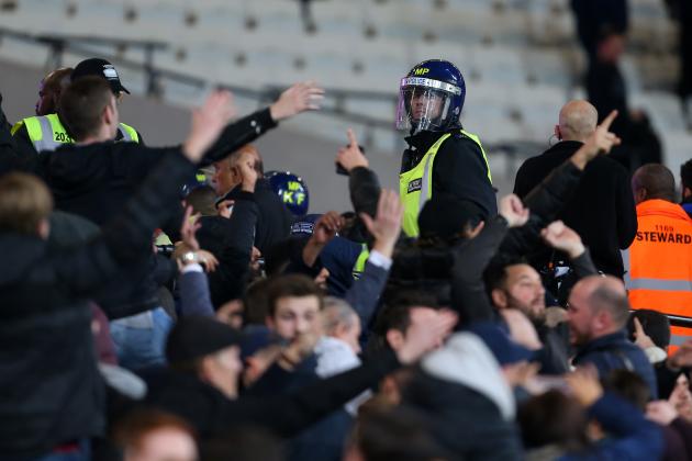 LONDON, ENGLAND - OCTOBER 26: A police officer in riot uniform keeps an eye on the fans as they taunt each other during the EFL Cup fourth round match between West Ham and Chelsea at The London Stadium on October 26, 2016 in London, England. (Photo by Catherine Ivill - AMA/Getty Images)
