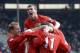 Roy Keane celebrates with his United team-mates.