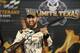 Austin Dillon shows off the award in victory late after taking the pole position for the NASCAR Sprint Cup auto race at Texas Motor Speedway Friday, Nov. 4, 2016, in Fort Worth, Texas. (AP Photo/LM Otero)