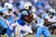 SAN DIEGO, CA - NOVEMBER 06: Melvin Gordon #28 of the San Diego Chargers runs with the ball as Jurrell Casey #99 of the Tennessee Titans chases during the second half of a game at Qualcomm Stadium on November 6, 2016 in San Diego, California. (Photo by Sean M. Haffey/Getty Images)