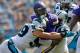 CHARLOTTE, NC - SEPTEMBER 25: Luke Kuechly #59 of the Carolina Panthers tackles Jerick McKinnon #21 of the Minnesota Vikings in the 3rd quarter during the game at Bank of America Stadium on September 25, 2016 in Charlotte, North Carolina. (Photo by Grant Halverson/Getty Images)